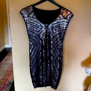 NWOT black body con mini dress with silver detail, size M